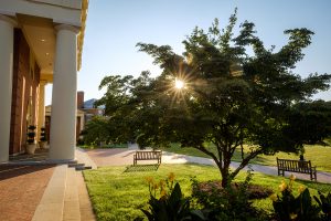 An early morning, late summer view of the Wake Forest campus on Wednesday, August 5, 2020. The morning sun peeks through trees on Hearn Plaza.