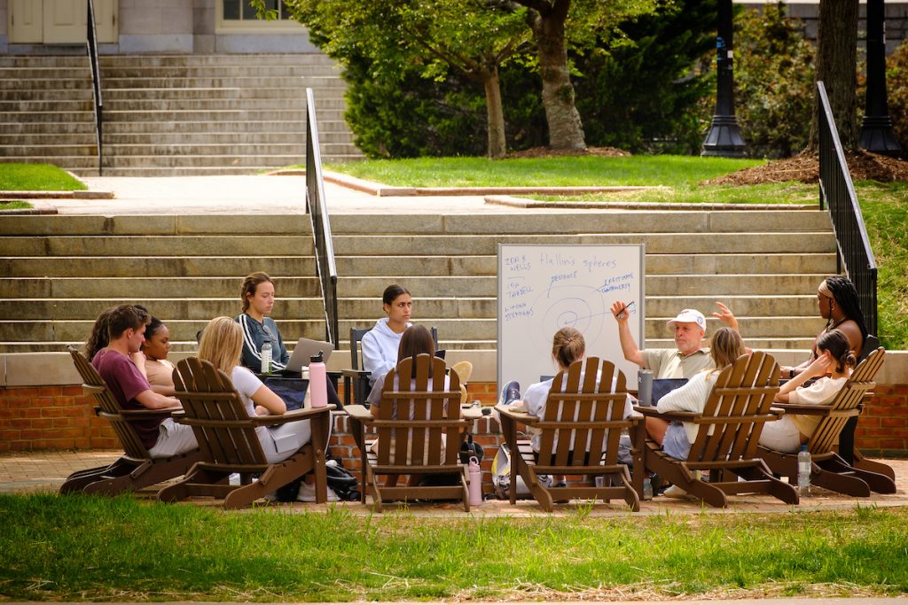 Wake Forest journalism professor Barry Yeoman takes his magazine writing class outside on Manchester Plaza on a warm spring day, on the campus of Wake Forest University on Monday, April 11, 2022.