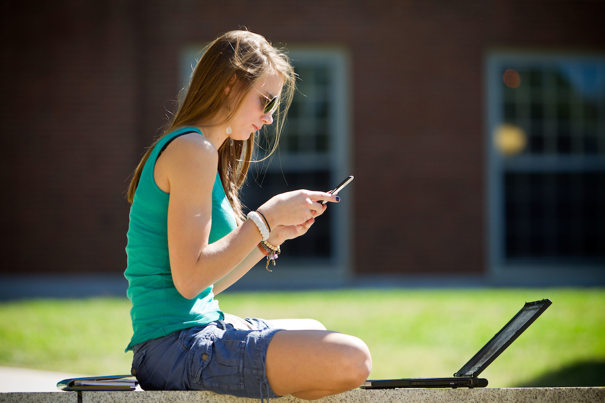 a student makes a phone call or sends a text