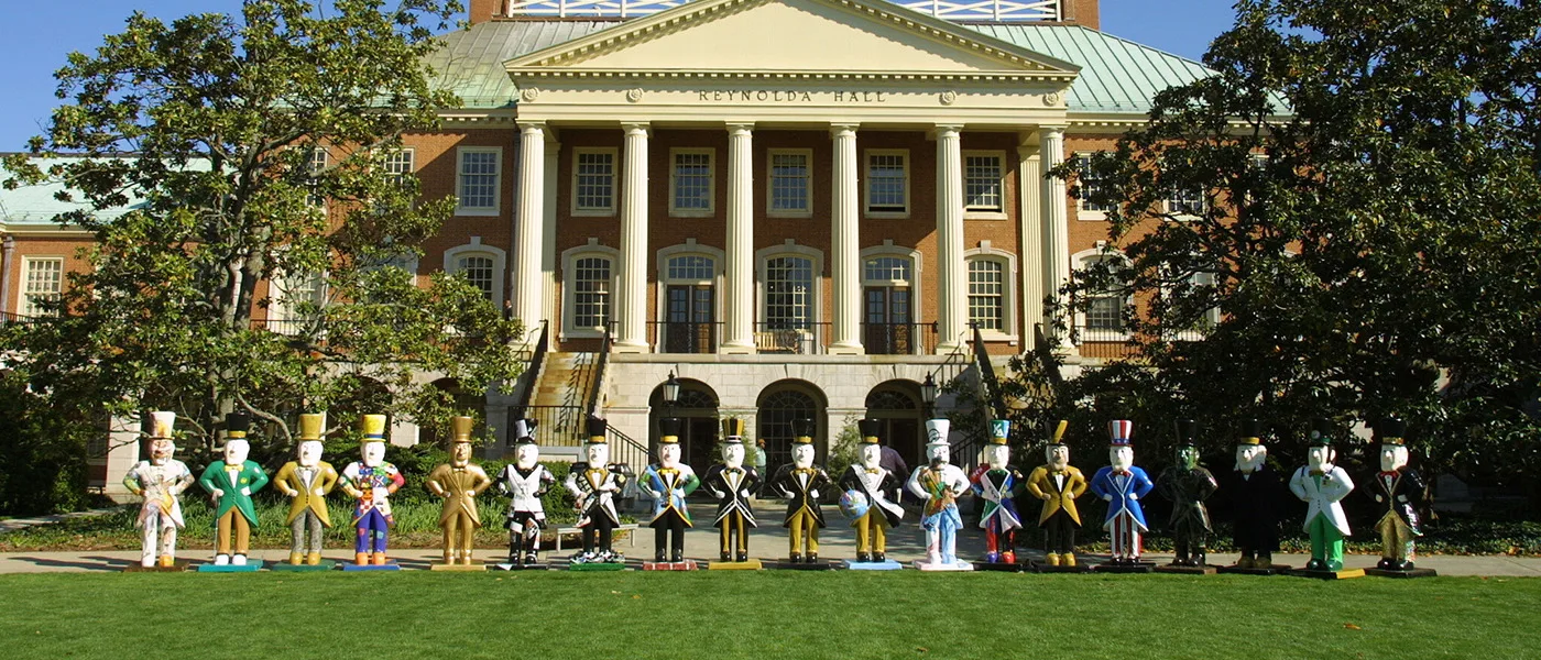 The front sides of the Deacons on Parade, with Reynolda Hall in the background