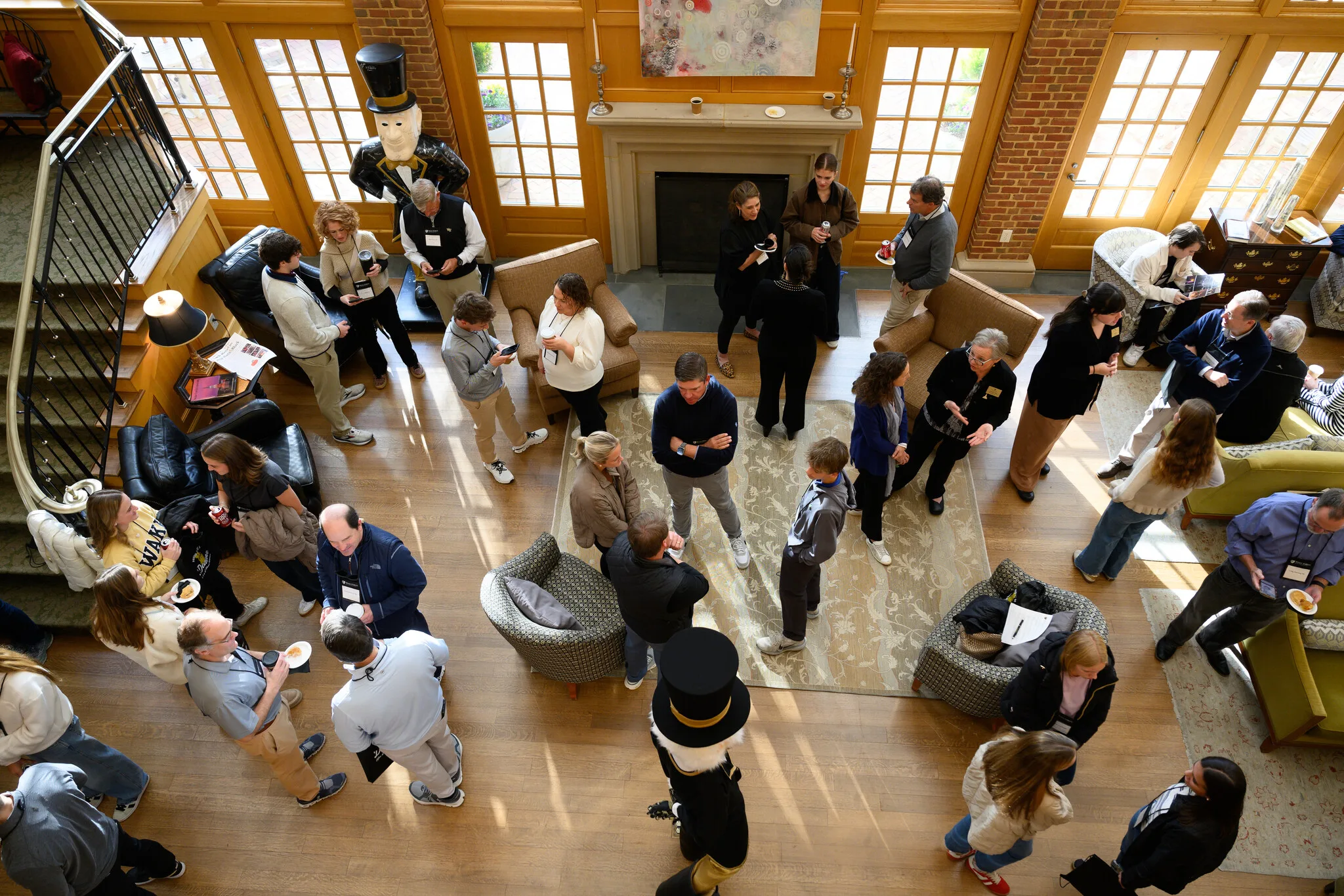 Wake Forest University alumni and their students or family members attend the Alumni Admissions Forum in the Byrum Welcome Center on Friday, November 14, 2025. Families gather in the atrium of the Bryum Welcome center for the morning gathering.