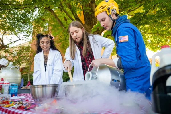 Science students run a booth for Project Pumpkin