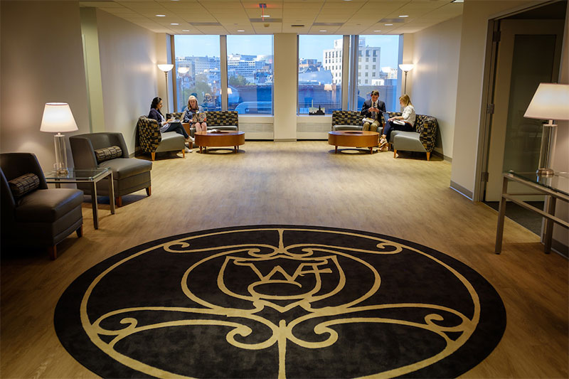 Students study in the lobby of the Wake Washington Center before class.