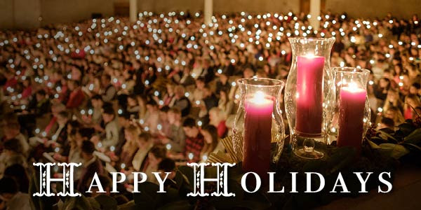 Happy Holidays with Lovefeast candles in the background