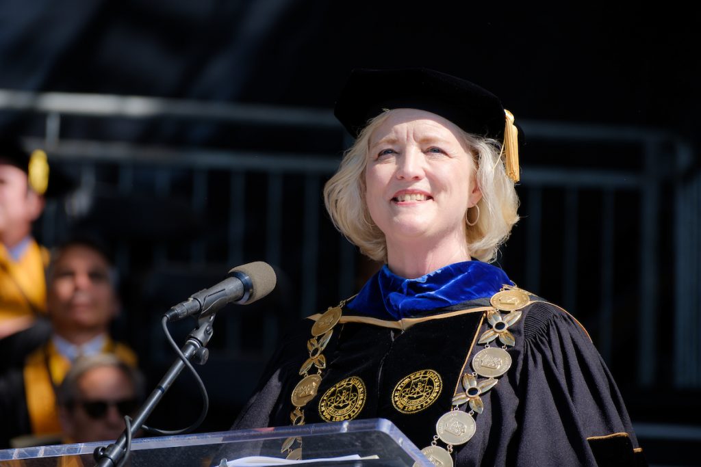 President Wente faces the audience from the stage.