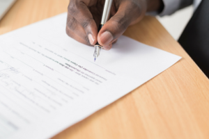 Man signing a Contract