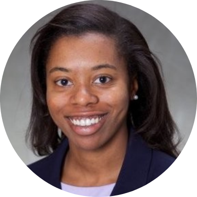 Headshot of Jasmine Little, She is wearing a suit and smiling.