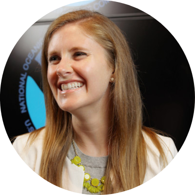 headshot of Kate Brogan, she has strawberry blonde hair and is smiling