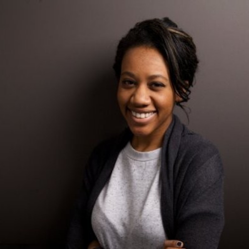 Headshot of Lauren Mahomes, she is wearing a black blazer and a big smile