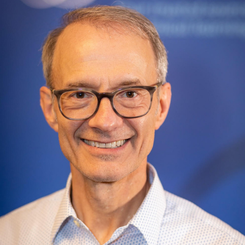 Headshot of Dr. Jeffery Hogg, he is wearing a collard shirt, glasses, and a smile