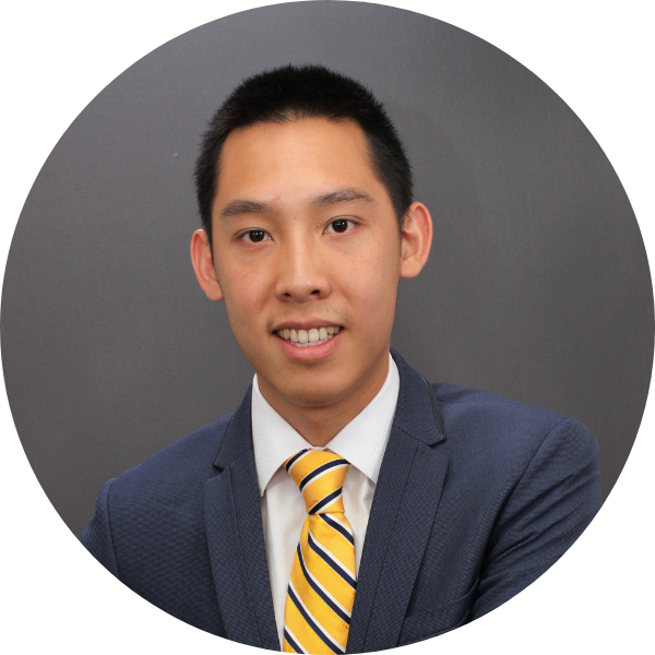 Man in coat and yellow tie