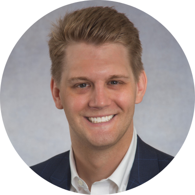 Circular photo of blonde man smiling at the camera