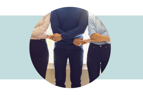 Three people with arms crossed over body and holding hands, linked together