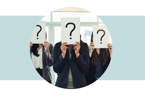 People holding up white sheets of paper over their faces with question marks on them