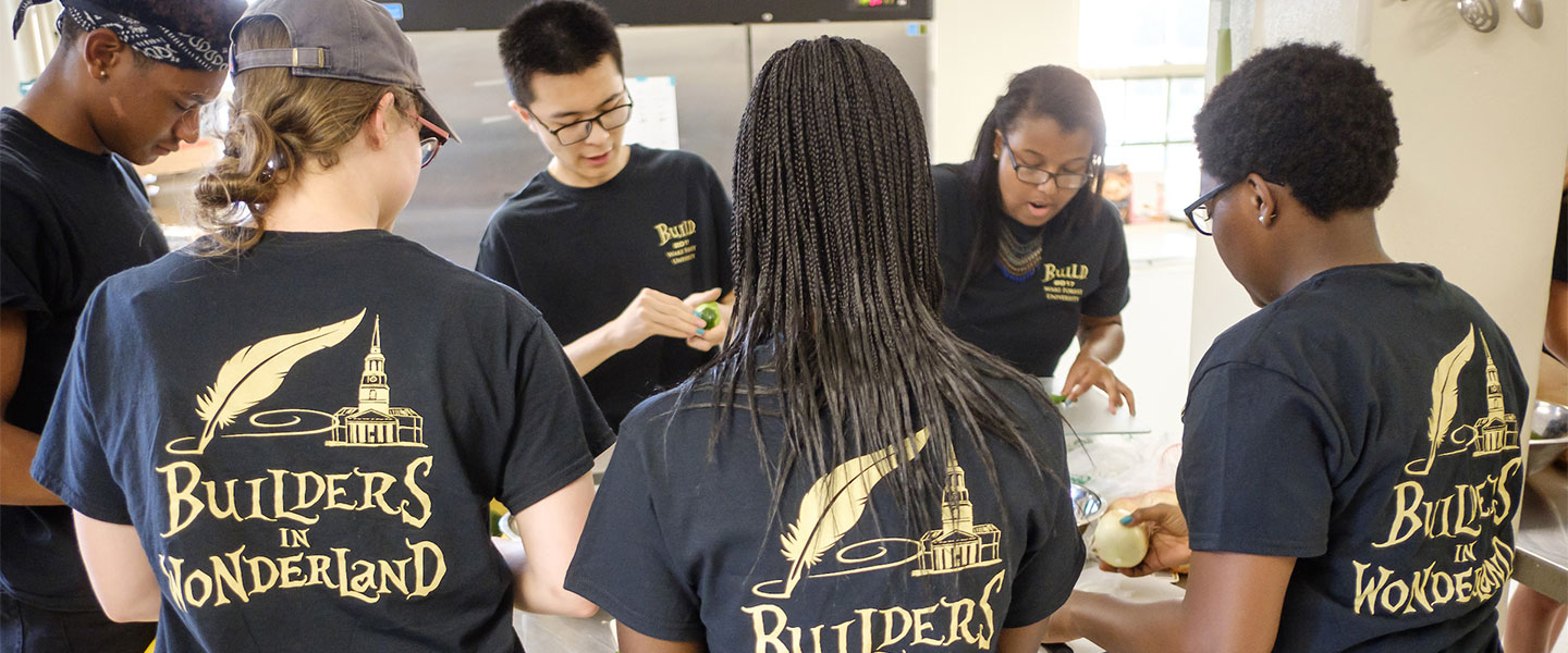 New Wake Forest students in the BUILD pre-orientation program prepare a communal pot luck dinner in the Campus Kitchen space