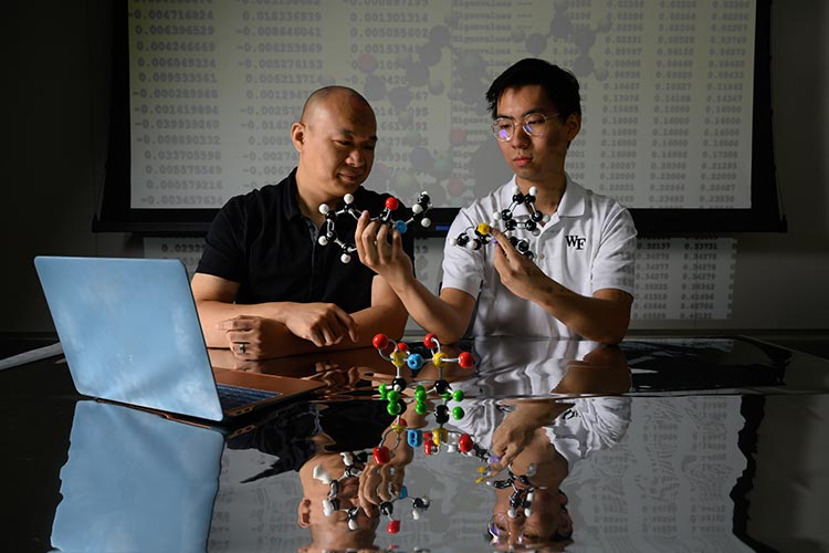 Chemistry Prof. Wendu Ding and URECA Scholar Leo Liu, ’26, pose for portrait in Salem Hall for a story about their research.