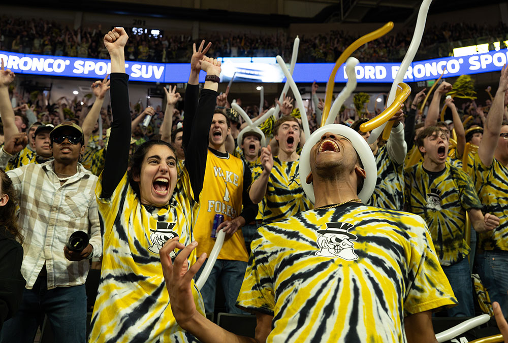 Students cheer during a men's basketball game