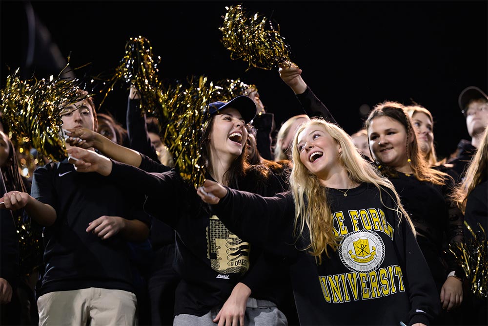 Wake Forest student cheer for their Demon Deacons