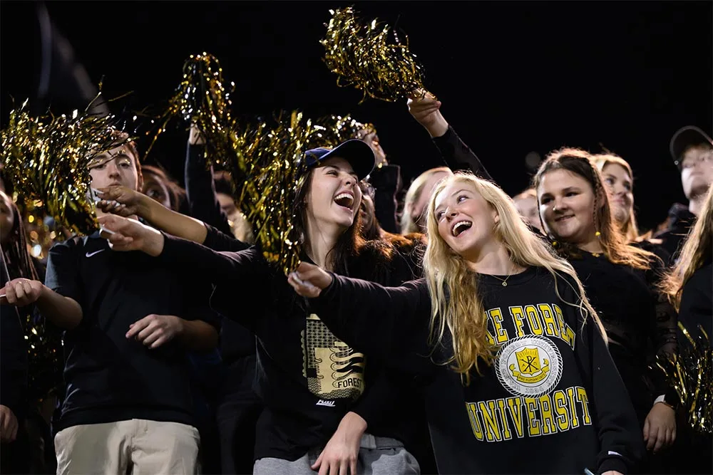 Wake Forest student cheer for their Demon Deacons