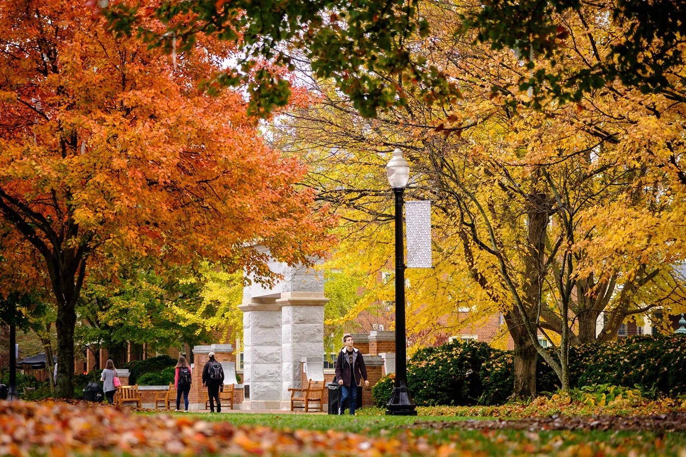 Wake Forest students walk across Hearn Plaza on a fall day.