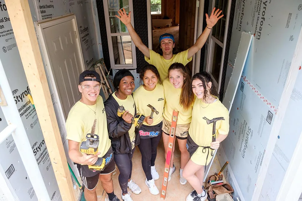 New Wake Forest students in the SPARC pre-orientation program work on a Habitat for Humanity house in Winston-Salem.