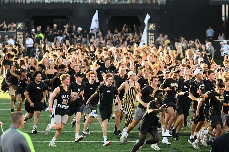 Students run across the field as part of the Deacon Dash for first-year students.