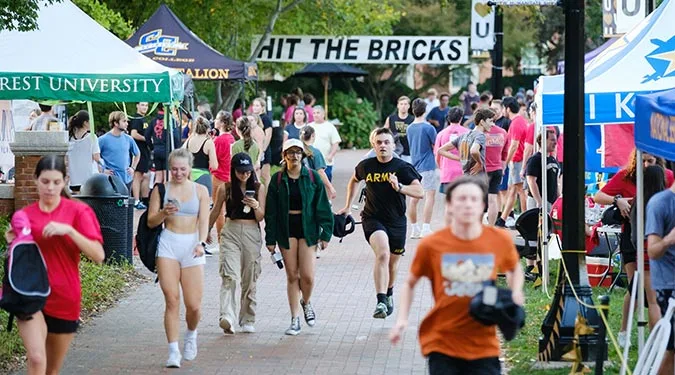 Members of the Wake Forest community run and walk laps around Hearn Plaza to raise money for cancer research during the annual Hit the Bricks for Brian fundraiser.