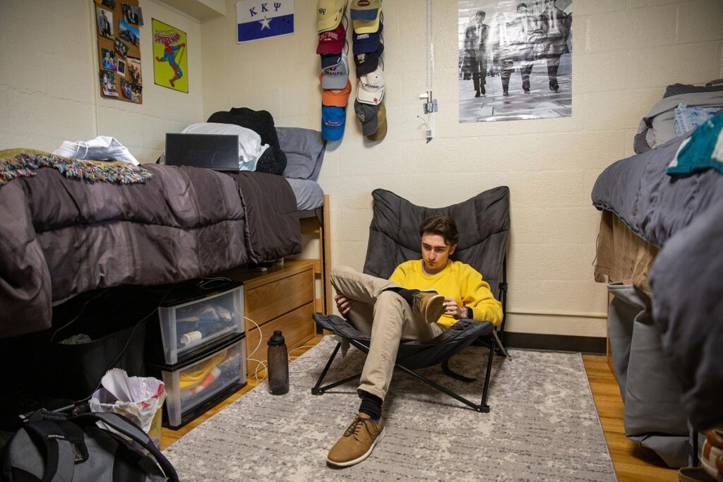 Wake Forest student studies in his Davis Residence Hall room