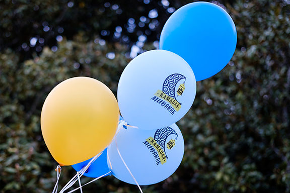 Blue and gold balloons decorate a Ramadan celebration on Manchester Plaza at Wake Forest University