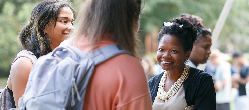 VP for Campus Life Dr. Shea Kidd-Brown greets students during a New Deac Week cookout