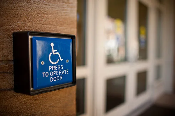 An automatic door opener outside the Worrell Professional Center on the campus of Wake Forest University.