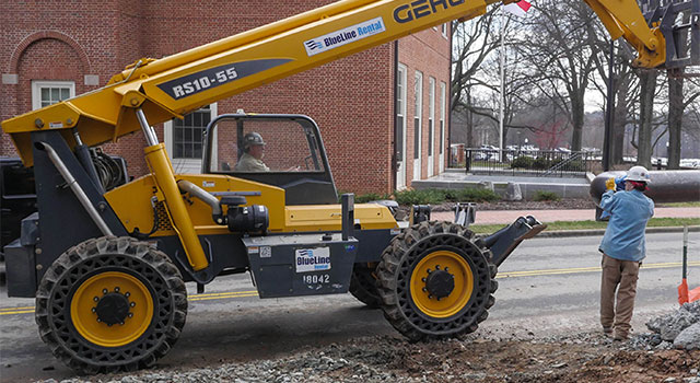 Contractors moving pipe for North Chiller Plant Construction