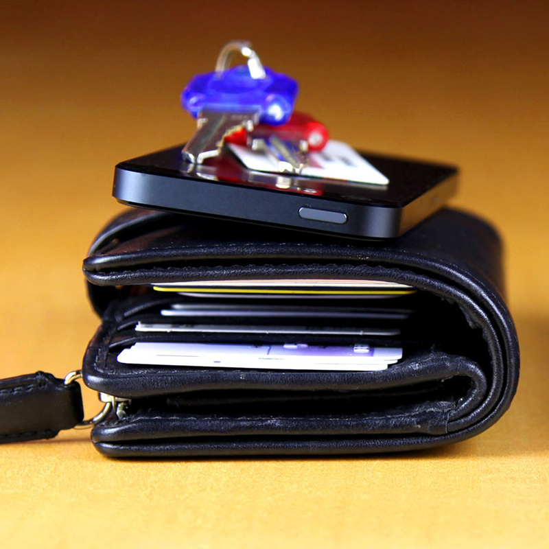 wallet, keys, and phone representing the lost and found items