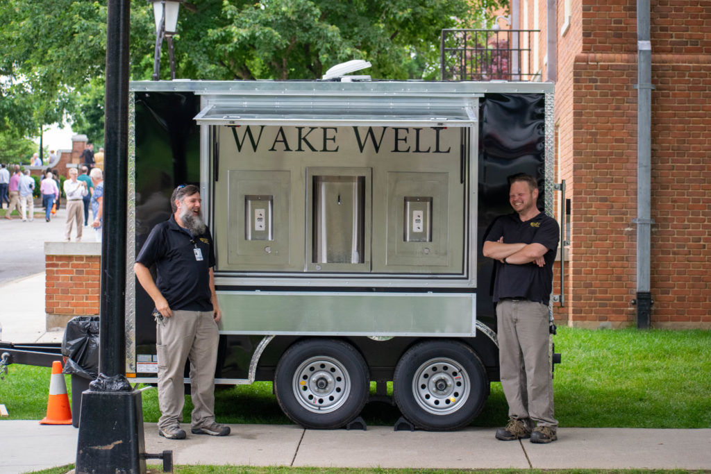 set hand sloan laughing by their awesome creation: the wake well