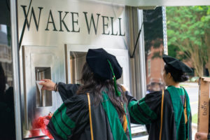 graduate students fill up at the wake well