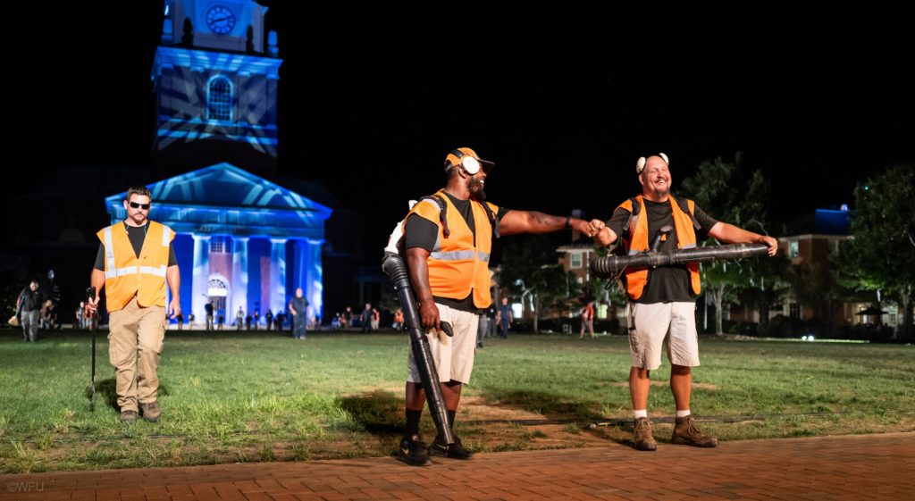 landscape workers celebrate