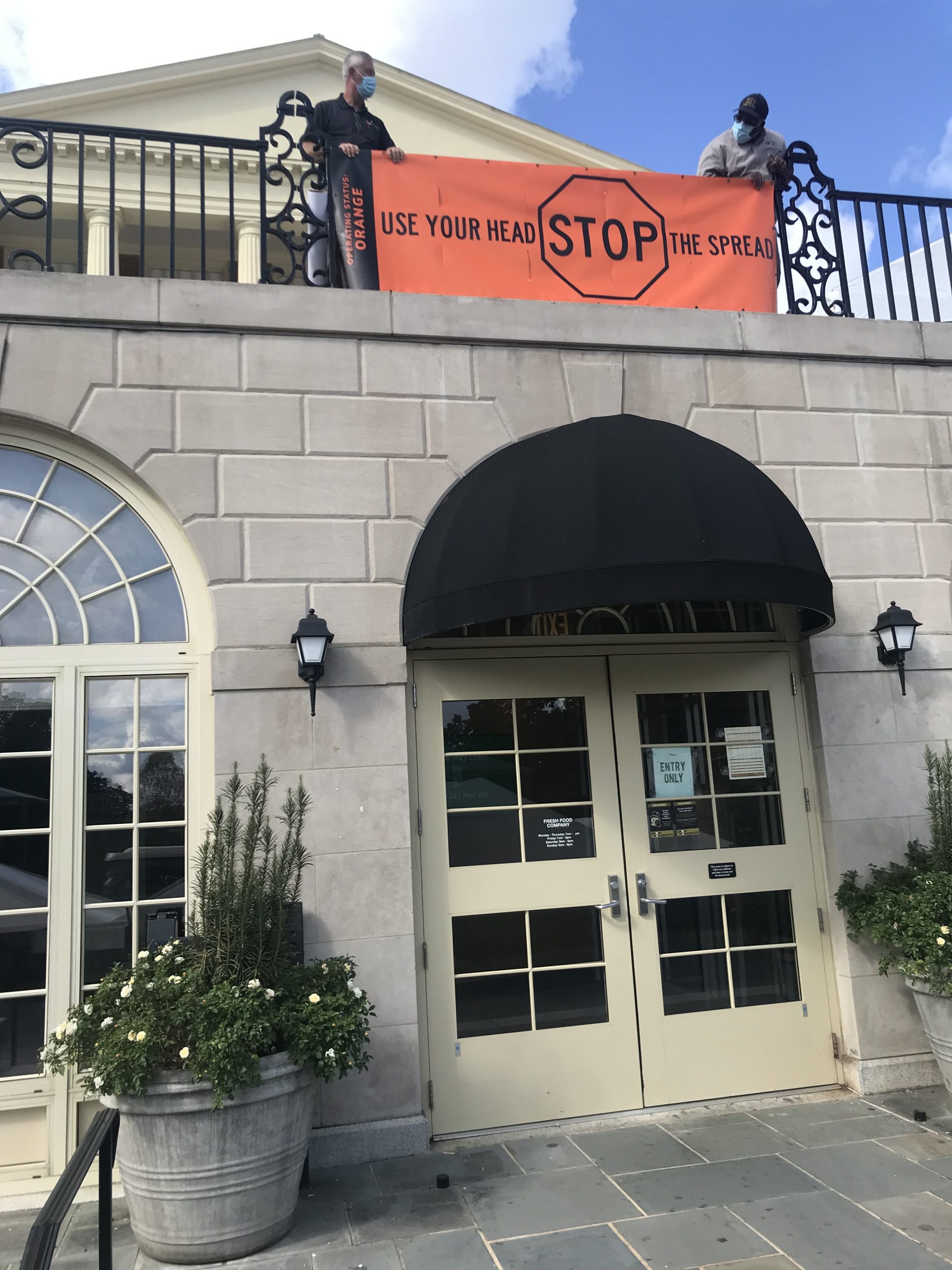 banner being hung at Reynolda