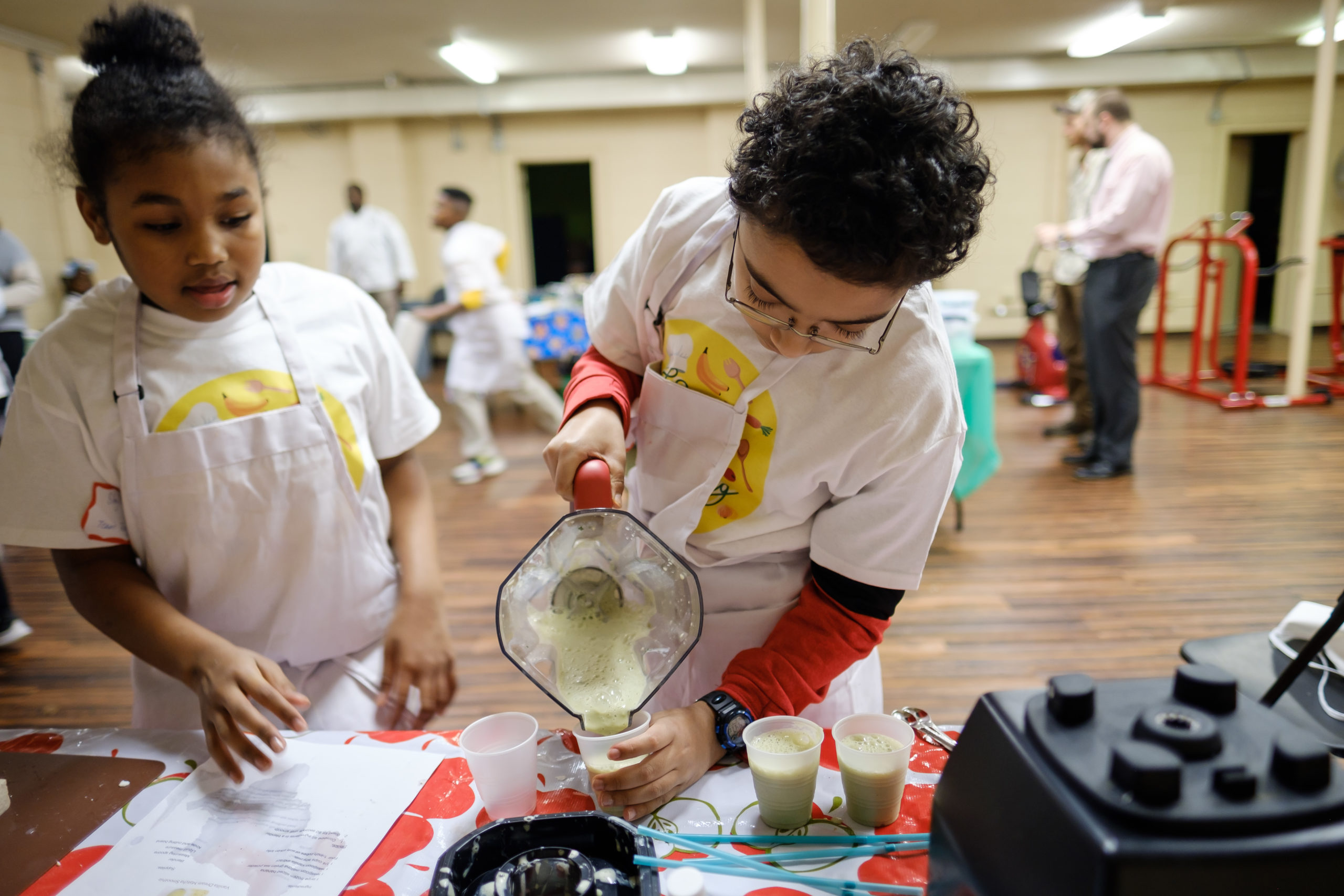 Students in the Kids Cooking Coalition program prep their meal for the 2020 Competition