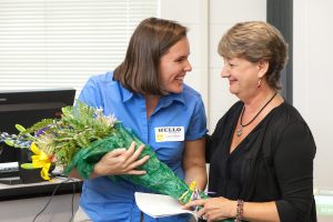 Mary Lynn Redmond presenting an award.