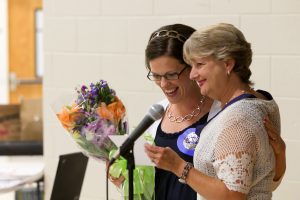 Mary Lynn Redmond presenting a teaching award.