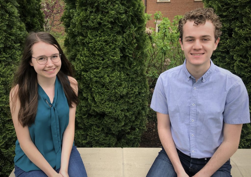 CAIR co-founders Ashley Peake and Tal Feldman sit on a bench