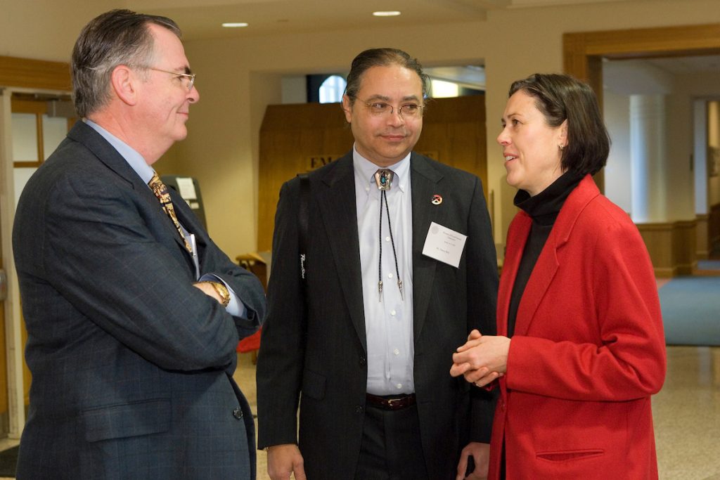 President Hatch is on the left with a conference attendee in the center and Professor Ulrike Wiethaus on the right.