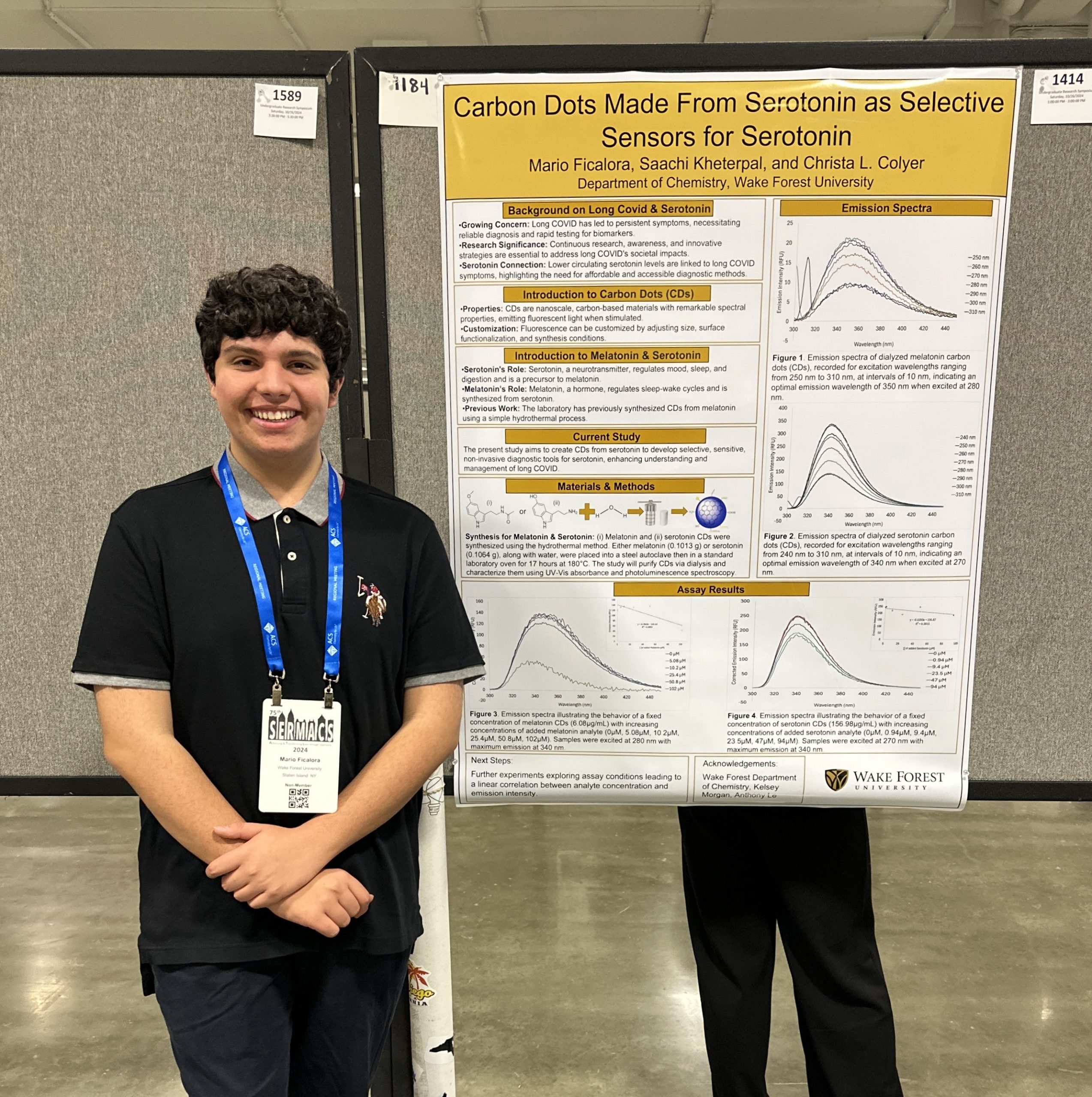 Mario Ficalora (‘27) stands next to his presentation at the SERMACS conference in Atlanta. 