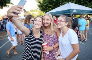 WFU students posing for a selfie at Taste of Winston Salem Event