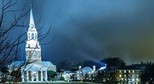Wait Chapel with spotlight on a stormy night