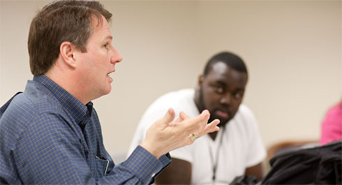 Computer science professor Brian Kell leads a discussion on digital technology in his seminar class.