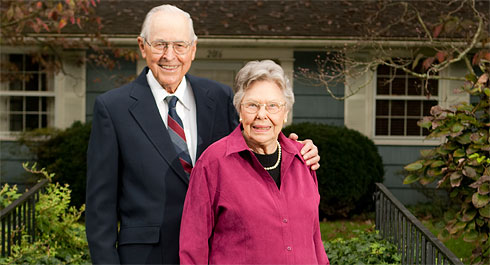 Henry and Elizabeth Stroupe in front of their Faculty Drive home in 2006.