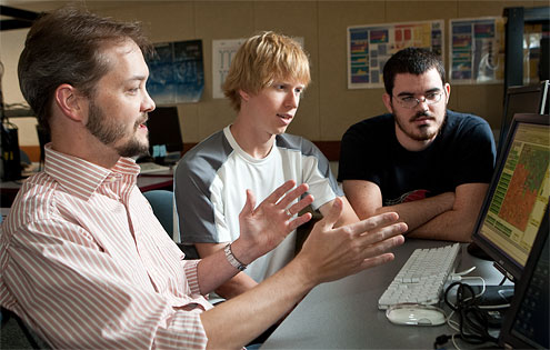 Computer science professor Errin Fulp works with graduate students Brian Williams (center) and Wes Featherstun (far right), who worked this summer at Pacific Northwest National Laboratory developing a new type of computer network security software modeled after ants.