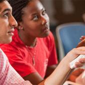 Freshmen Chris Iskander and Katrina Mayes use their iClickers in Robert Swofford’s introductory chemistry class.