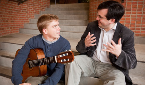 Presidential Scholar John Kossler receives some instruction from Chilean classical guitar virtuoso Carlos Perez.